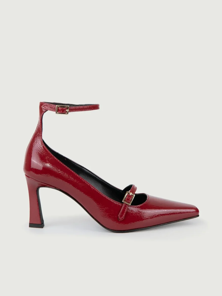 DÉCOLLETÉ CON CINTURINO IN VERNICE ROSSA.