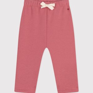 Pantaloni tinta unita rosa in tessuto felpato