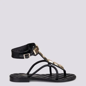 SANDALO INFRADITO CON BORCHIE